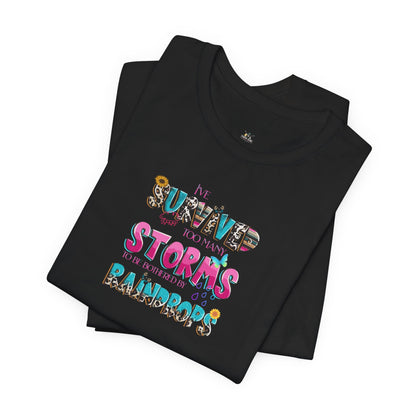 "I've Survived Too Many Storms to Be Bothered by Raindrops" Inspirational Graphic T‑Shirt